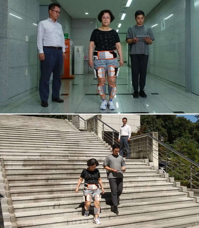 연구팀이 고령인의 다리에 보행보조 시스템을 붙인 다음 임상 시험을 진행하고 있다. ETRI 제공