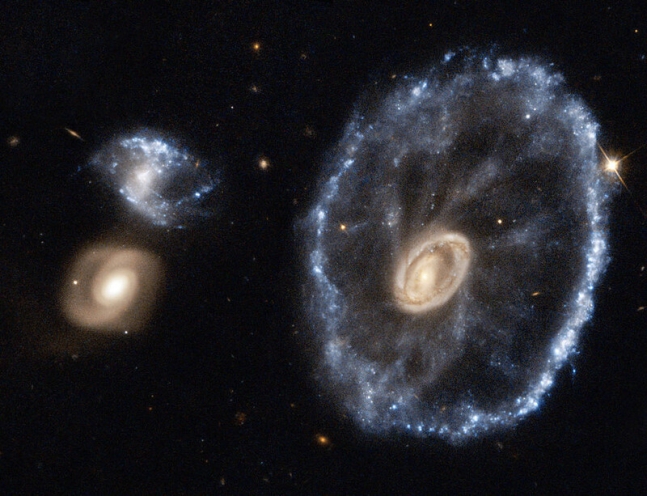 An image of a wheeled galaxy captured by the Hubble Space Telescope in 2018.  Courtesy of NASA